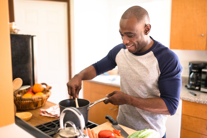 man standing happiness on the kitchen