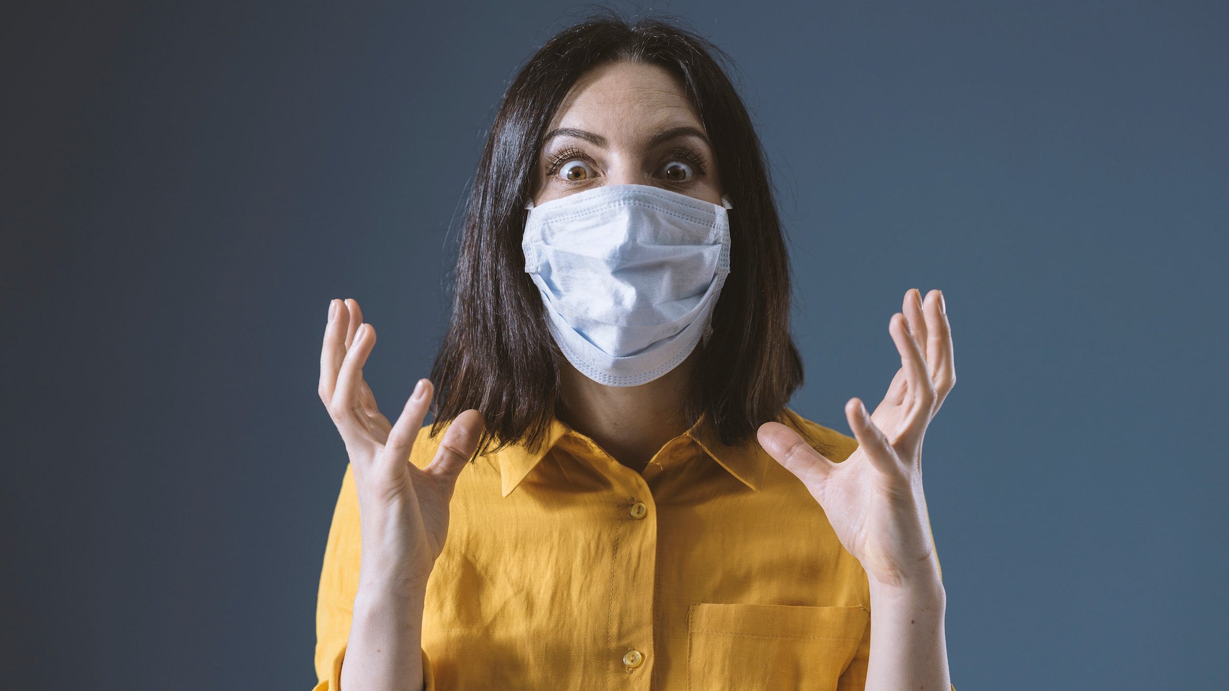 Stressed woman wearing a face mask against covid-19Stressed woman wearing a face mask