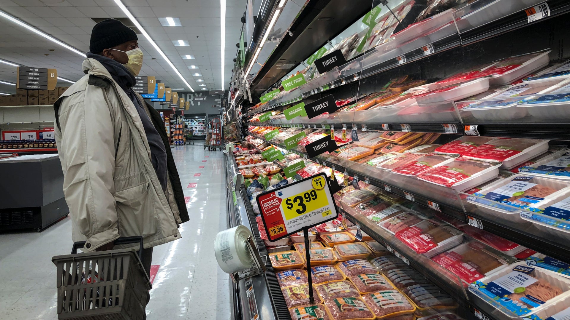 man shopping for meat from a meatpacking facility