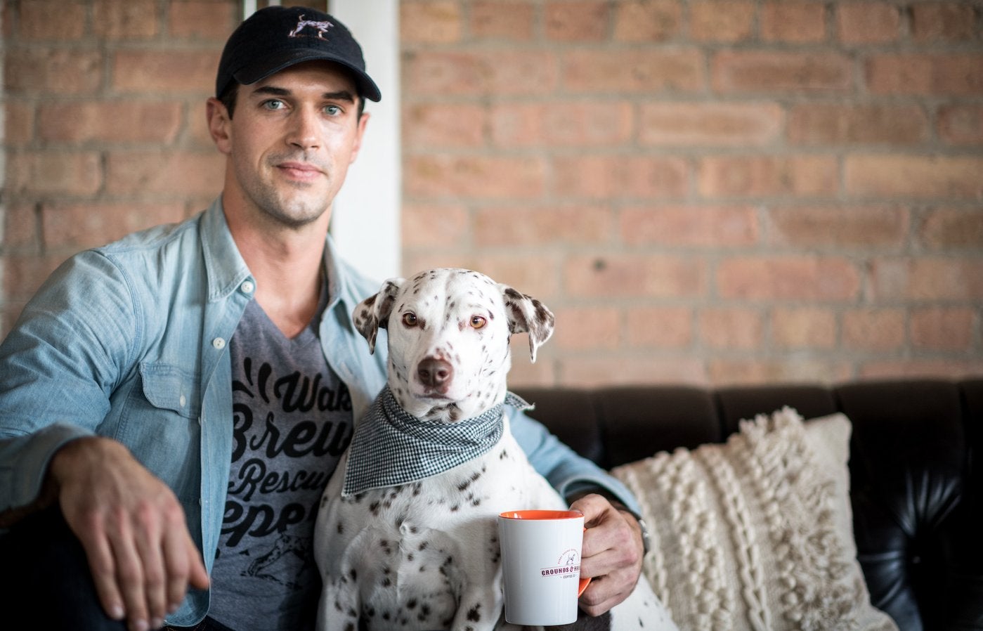 Grounds and Hounds Coffee founder Jordan Karcher with his dog Molly