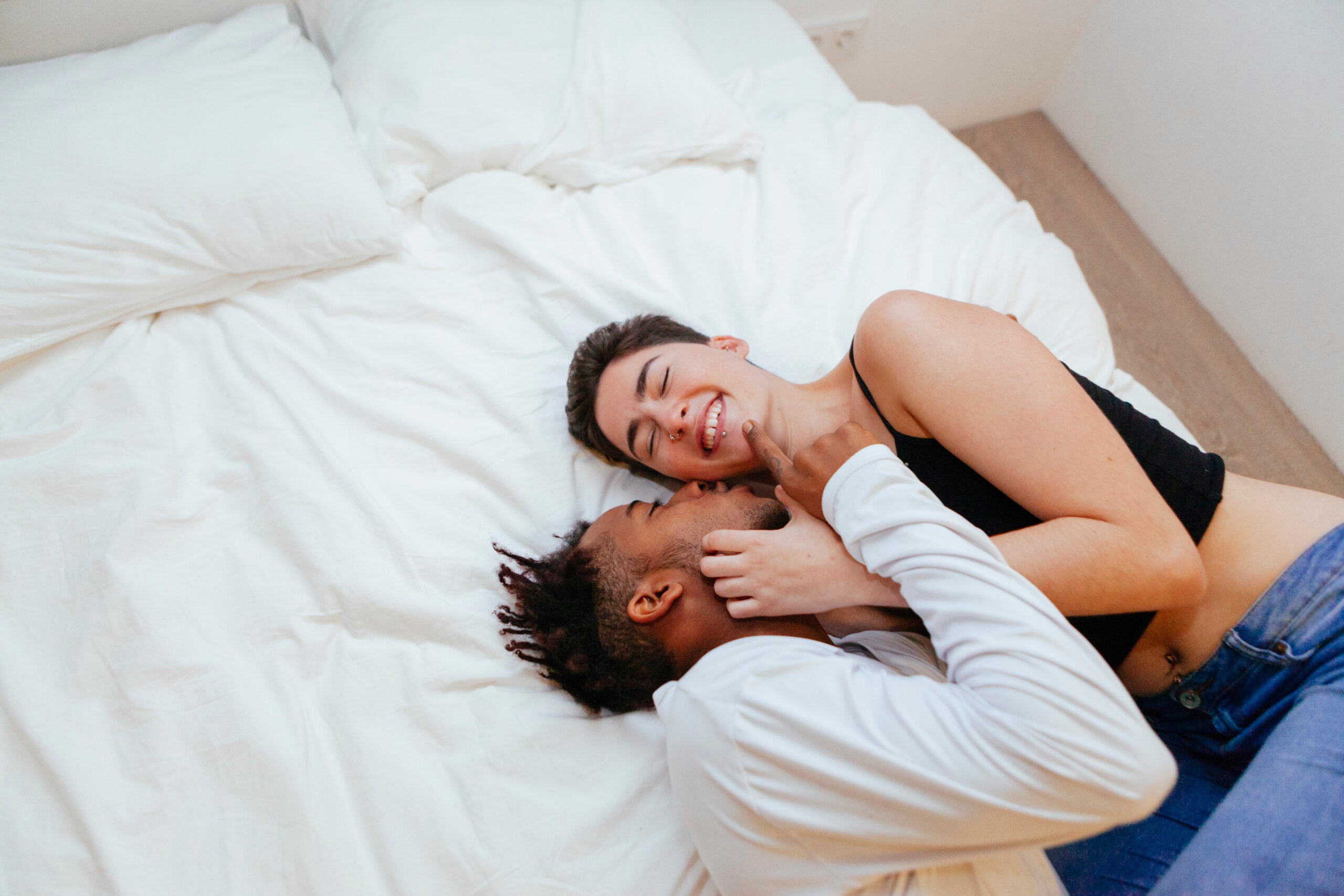 couple in bed to illustrate sexy vegan bedroom items