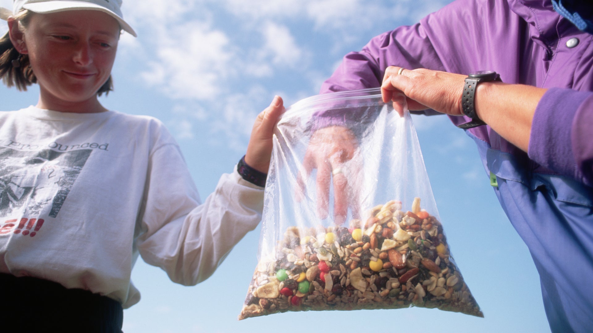 hikers share a bag of trail mix